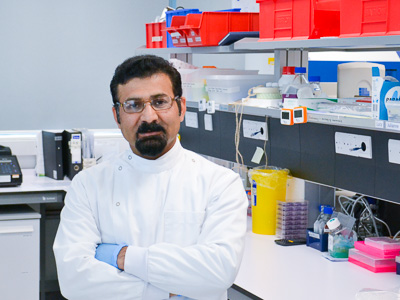 Professor Muhammad Munir standing in a lab.