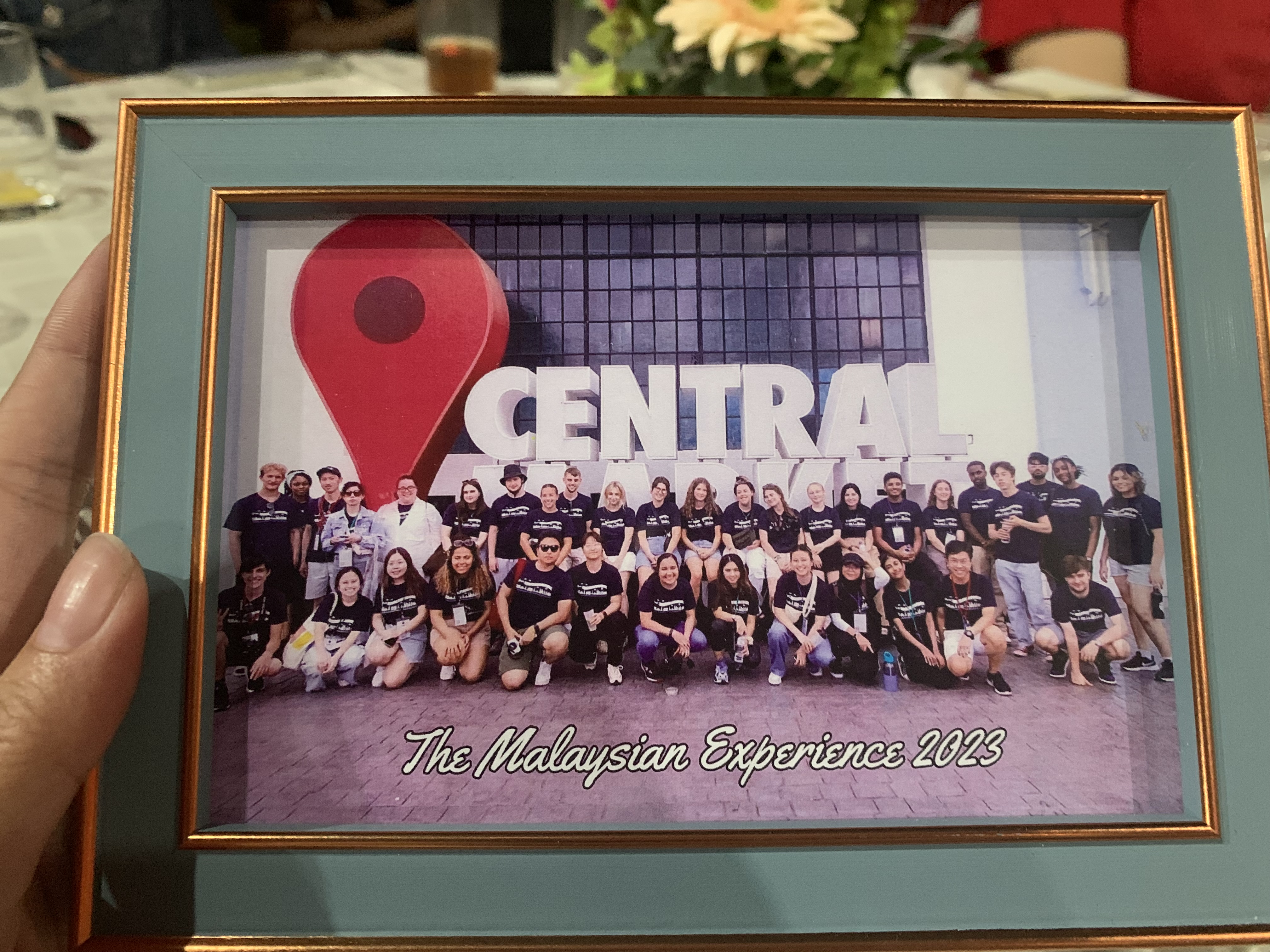 A framed photo of those who attended the Cultural Exchange program to Malaysia.