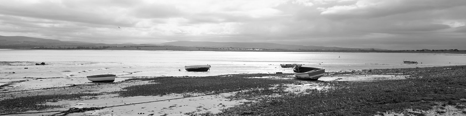 Looking out across Morecambe Bay from Sunderland Point. Black and white photo.