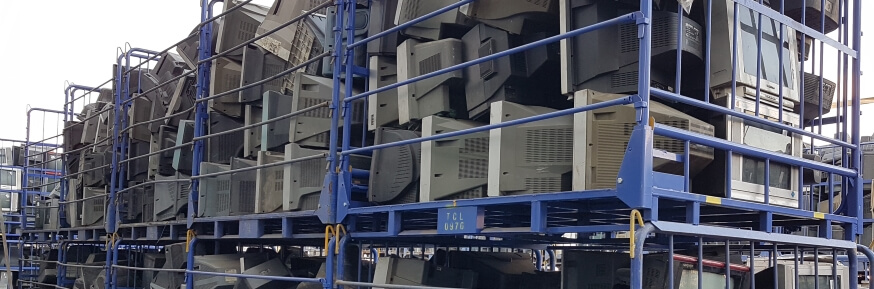 Cage of waste tv and computer screens at electronic waste plant, China