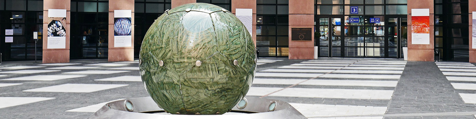 Green globe sculpture at EU Parliament