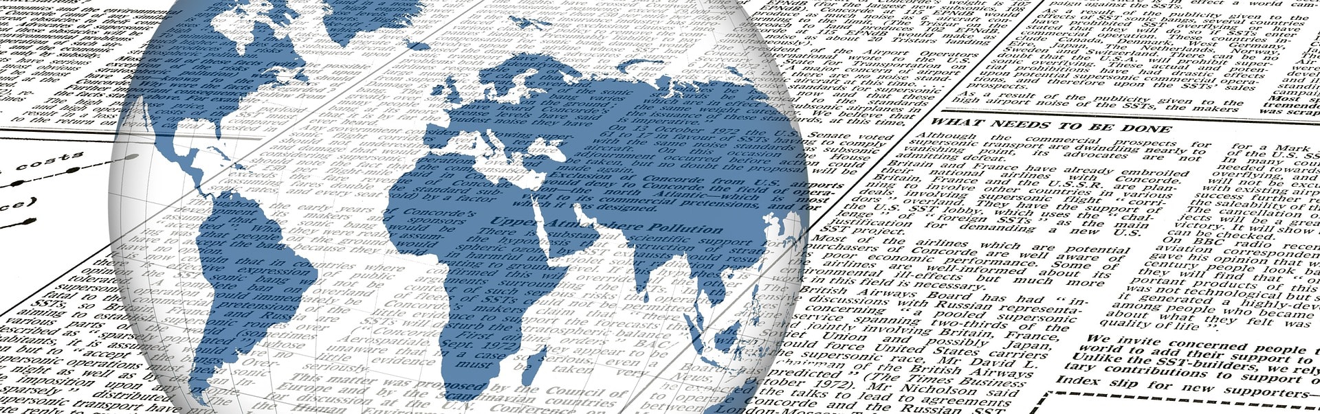 A globe super-imposed onto a newspaper